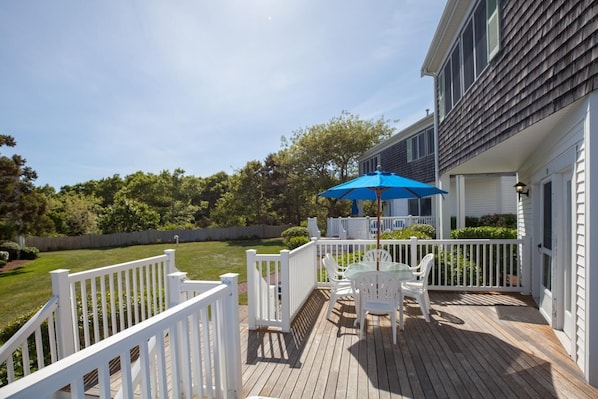 Bask in coastal sunshine or share a quiet meal under blue skies, just steps from open green space and sea air.