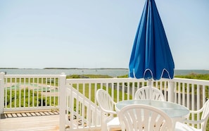 Savor slow mornings or sunset chats with panoramic water views and the calming breeze of the harbor.
