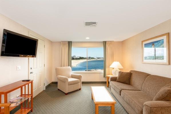 Lounge with a view where coastal light pours in and every glance out the window invites you to the shoreline.
