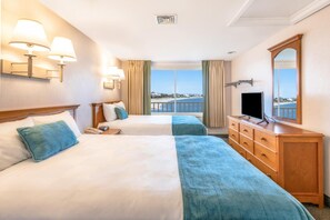 Rest easy in a serene retreat where soft textures and water views set the tone for peaceful Cape Cod nights.