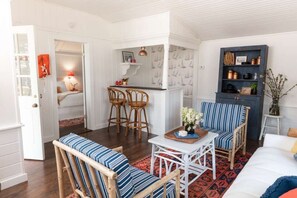 Casual elegance and playful charm fill this coastal cottage, perfect for slow mornings and spirited evenings.
