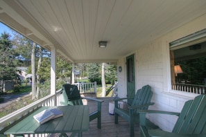 Ease into a slower rhythm on this shaded porch, where forest views and fresh air invite you to linger.
