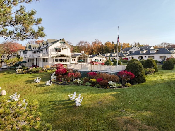 Linger on lush green lawns surrounded by vibrant blooms and the gentle rhythm of slow afternoons.