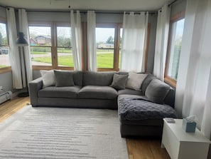 Large sunroom with lake views and smart TV