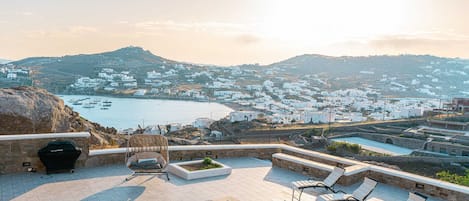 Private terrace with panoramic sea and valley views
Enjoy your morning coffee or evening wine while soaking in breathtaking views of the Aegean and Mykonian countryside from your private terrace.