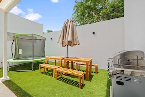 BBQ outside and enjoy at the patio table.