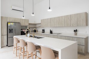 Custom-built kitchen with high-end appliances.