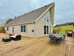 Outdoor dining table and cozy side sofa—perfect for enjoying meals and fresh air.