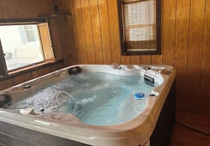 Soak your worries away in the private hot tub!