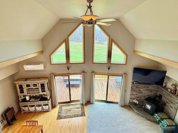 Spacious living room with high ceilings, bright, open, and inviting.