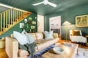 The main floor living room is a bright and inviting space, perfect for relaxation and gathering with loved ones