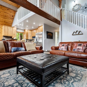 Living area with leather seating, fireplace, and Smart TV
