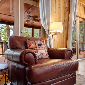 Living area with leather seating, fireplace, and Smart TV
