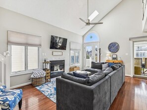 Spacious dining area with seating for the whole family, offering direct access to the deck for al fresco dining with a view.