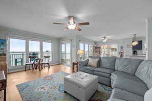 Living room and dining area with ocean views!