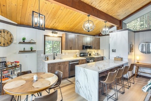 Kitchen & Dining Room | 2-Story Cabin | Main Level | Dishware & Flatware