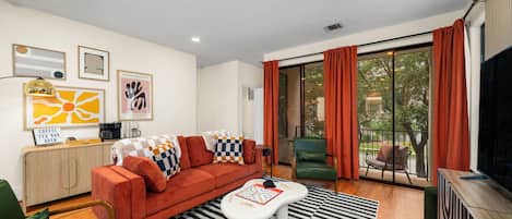 Living room with eclectic vibe and a coffee cart at the back