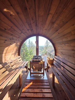 Panaromic barrell steam sauna overlooking the lake and pine forest