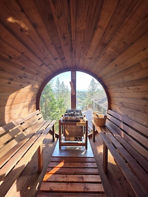 Panaromic barrell steam sauna overlooking the lake and pine forest