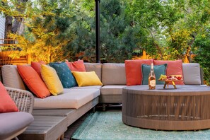 Sip wine on this vibrant outdoor lounge surrounded by lush greenery!