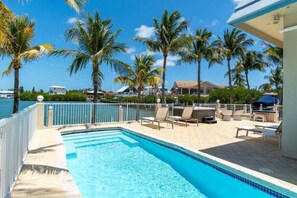 Sun-soaked poolside paradise with tropical vibes.
