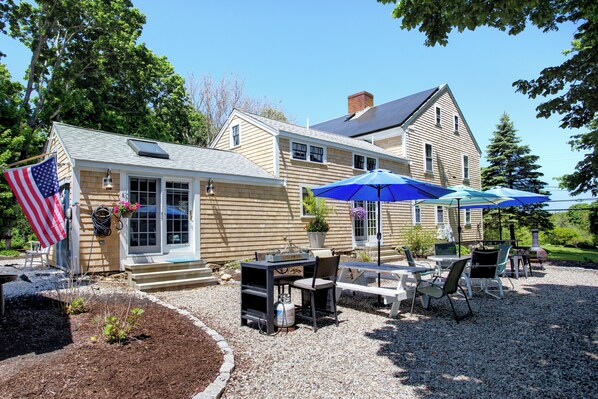 In both downstairs rooms, French doors open onto the east patio.