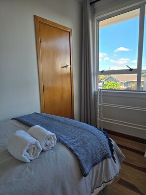 Own wardrobe, towel rack available to use