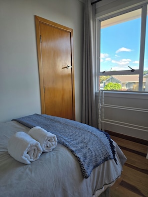 Own wardrobe, towel rack available to use