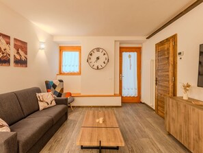 Furniture, Interior Design, Flooring, Wood, Floor, Couch, Wood Flooring, Ceiling, Room, Living Room