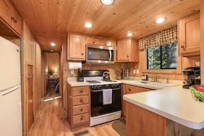 Whip up your favorite meals in our fully stocked kitchen—complete with all the essentials for cooking, dining, and enjoying cozy nights in.