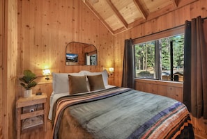 Small but cozy, the primary bedroom features a comfy queen bed—your perfect place to unwind after a day of Tahoe adventures.