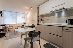 Chic studio apartment with modern amenities, cozy seating, and abundant natural light—perfect for a relaxing stay in the heart of Chile.