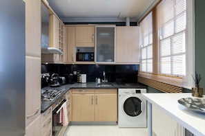 Bright and fully equipped kitchen.