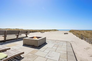 built in wood burning fire pit off of living room