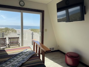 queen bedroom with balcony and ocean view
