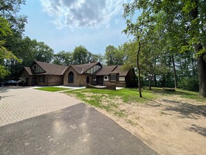 Exterior of home and a large circle driveway.