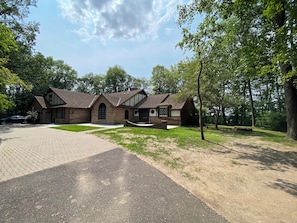 Exterior of home and a large circle driveway.