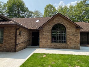 Main entrance of the house on the left where the keypad is for entry.