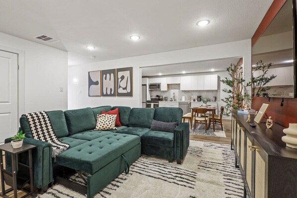 Once you enter the living room you'll find a space that feels both luxurious and cozy, perfect for unwinding after a long day.