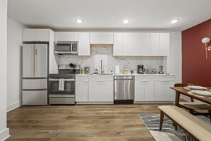 As you approach kitchen the elegant layout and well-stocked shelves make it the ideal spot to relax.