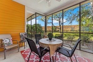 Dine alfresco or enjoy a cocktail on the screened patio