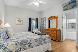 This king suite boasts a private ensuite bath with smart TV