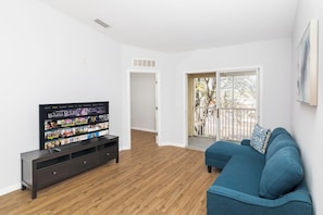 Relax in the cozy living room, stream your favorites on the smart TV, and patio access