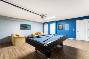 Rack 'Em Up and unwind in the game room with pool table