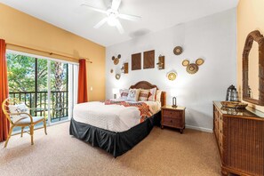 Mickey-themed queen bedroom with a private ensuite with ceiling fan