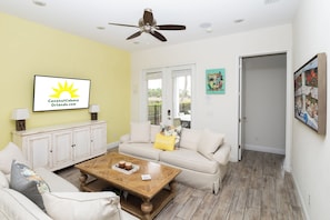 Curl up in the coastal living room & stream all your favorite entertainment