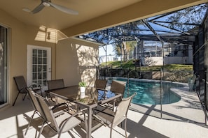 Dine alfresco or enjoy a cocktail on the screened patio