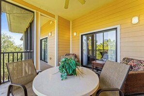 Enjoy morning coffee or dine alfresco on the breezy screened balcony
