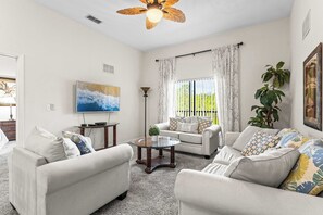 5Cozy living room featuring a smart TV and a full-size sleeper sofa