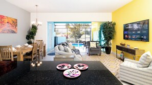 Kitchen bar looking into living room and pool